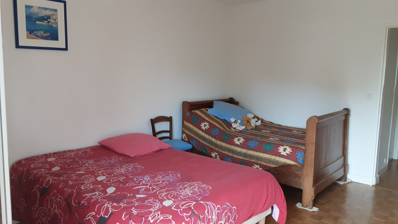 Bedroom with on double bed and one simple bed